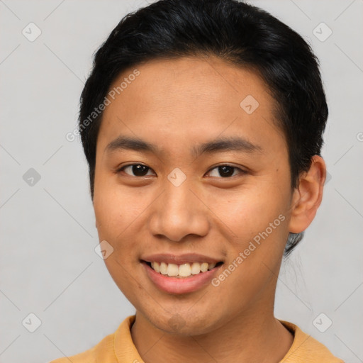 Joyful asian young-adult male with short  brown hair and brown eyes