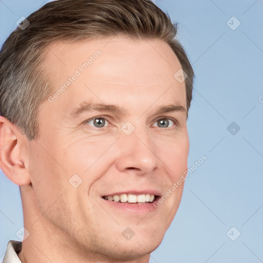 Joyful white adult male with short  brown hair and grey eyes