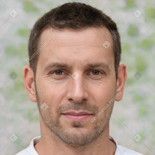 Joyful white adult male with short  brown hair and brown eyes