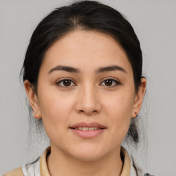 Joyful white young-adult female with medium  brown hair and brown eyes