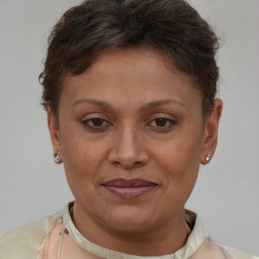 Joyful white adult female with short  brown hair and brown eyes