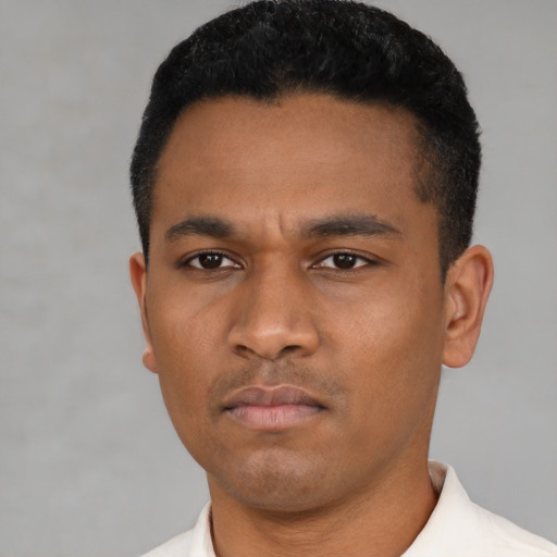 Neutral latino young-adult male with short  black hair and brown eyes