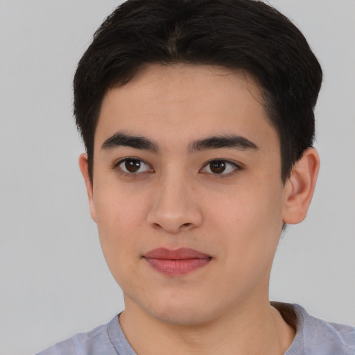 Joyful asian young-adult male with short  brown hair and brown eyes