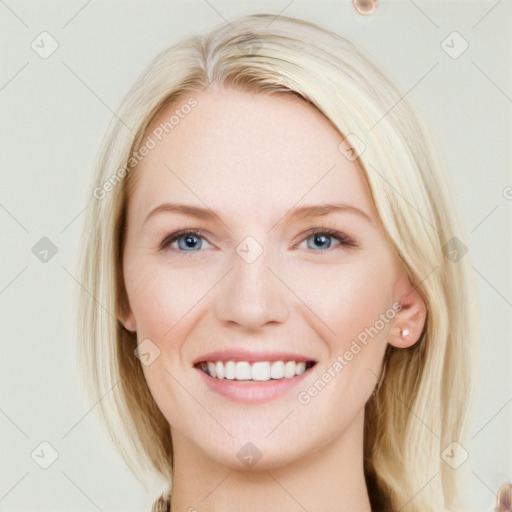 Joyful white young-adult female with long  brown hair and blue eyes