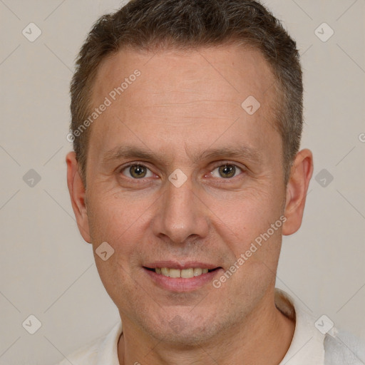 Joyful white adult male with short  brown hair and brown eyes