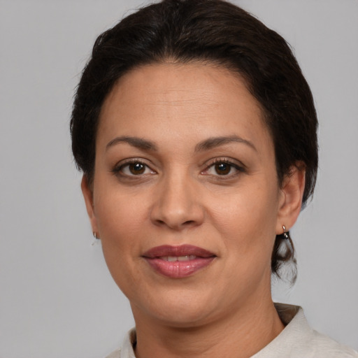 Joyful white adult female with short  brown hair and brown eyes