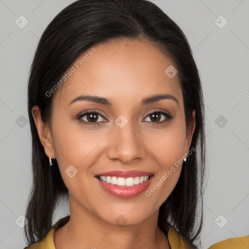 Joyful latino young-adult female with long  brown hair and brown eyes