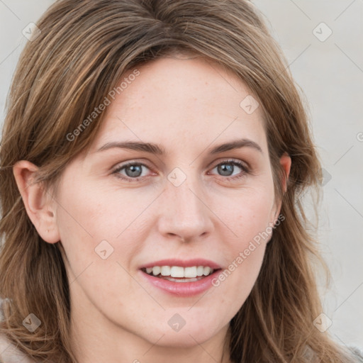 Joyful white young-adult female with long  brown hair and blue eyes