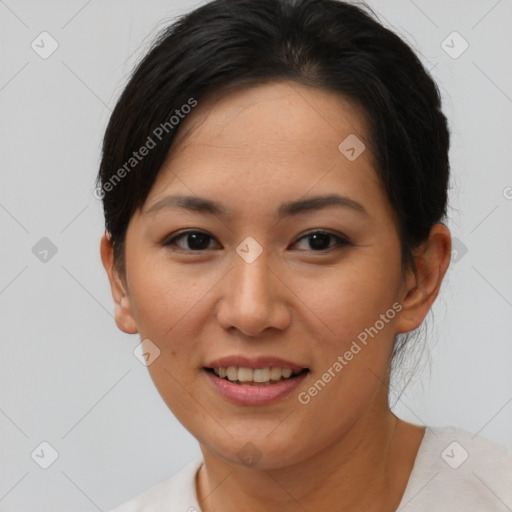 Joyful asian young-adult female with short  brown hair and brown eyes