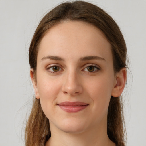 Joyful white young-adult female with long  brown hair and grey eyes