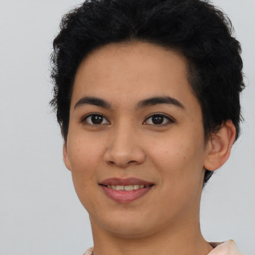 Joyful asian young-adult female with short  black hair and brown eyes