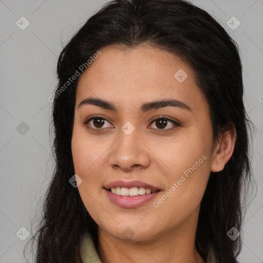 Joyful latino young-adult female with long  brown hair and brown eyes