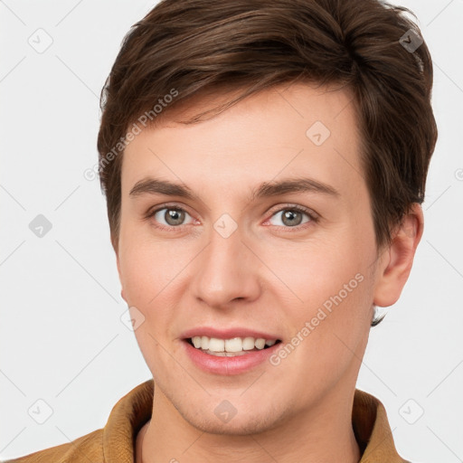 Joyful white young-adult female with short  brown hair and grey eyes