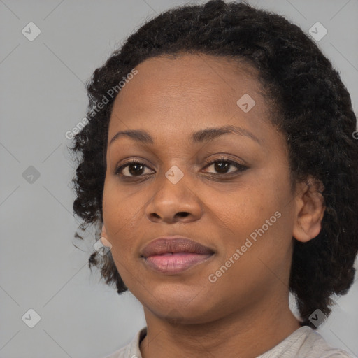 Joyful black young-adult female with medium  black hair and brown eyes