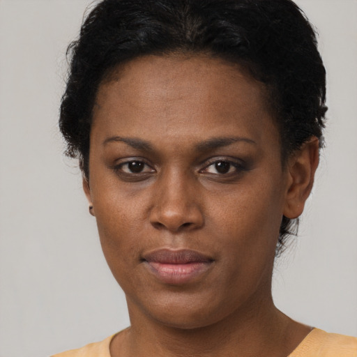 Neutral black adult female with short  brown hair and brown eyes
