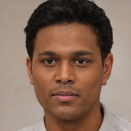 Neutral black young-adult male with short  black hair and brown eyes