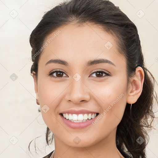 Joyful white young-adult female with long  brown hair and brown eyes