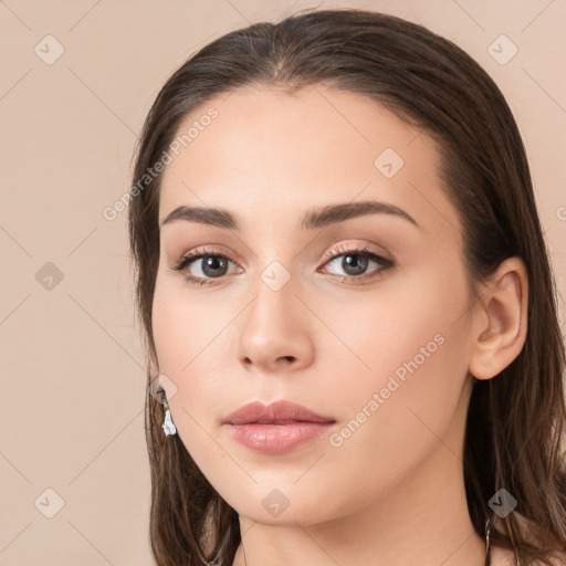 Neutral white young-adult female with long  brown hair and brown eyes