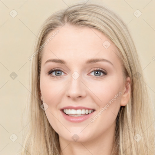 Joyful white young-adult female with long  brown hair and blue eyes