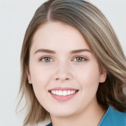 Joyful white young-adult female with long  brown hair and blue eyes