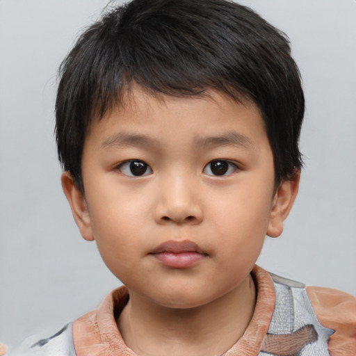 Neutral asian child male with short  brown hair and brown eyes