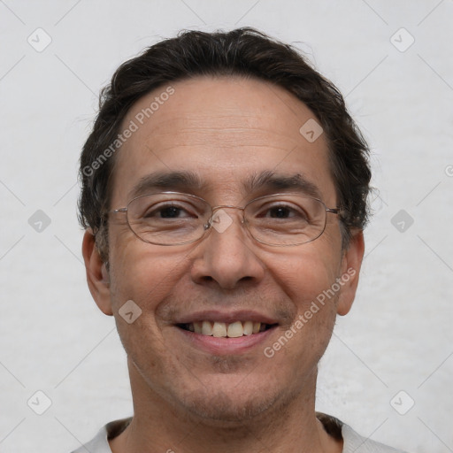 Joyful white adult male with short  brown hair and brown eyes