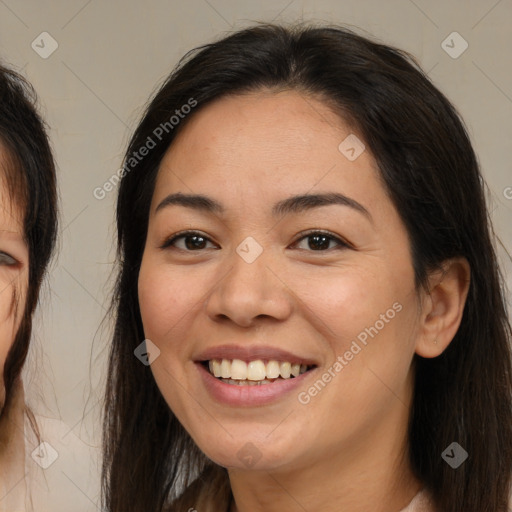 Joyful latino young-adult female with medium  brown hair and brown eyes