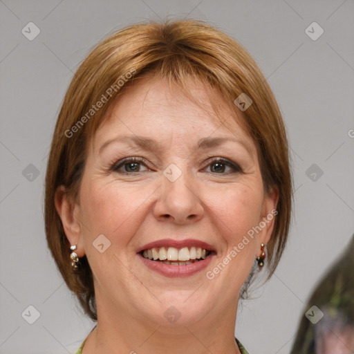 Joyful white adult female with medium  brown hair and blue eyes