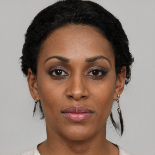 Neutral black young-adult female with short  black hair and brown eyes