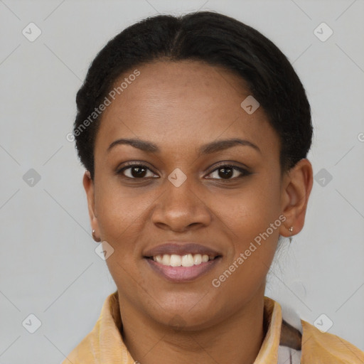 Joyful black young-adult female with short  brown hair and brown eyes