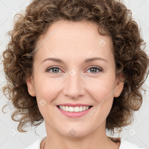 Joyful white young-adult female with medium  brown hair and green eyes