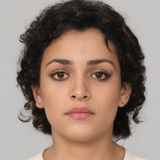 Neutral latino young-adult female with medium  brown hair and brown eyes