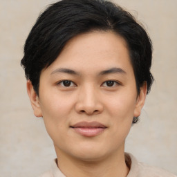 Joyful asian young-adult female with short  brown hair and brown eyes