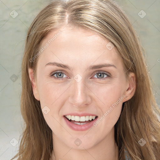 Joyful white young-adult female with long  brown hair and blue eyes