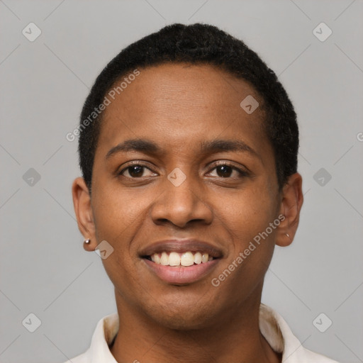 Joyful black young-adult male with short  black hair and brown eyes