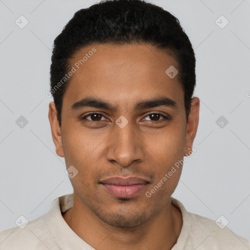 Joyful black young-adult male with short  black hair and brown eyes