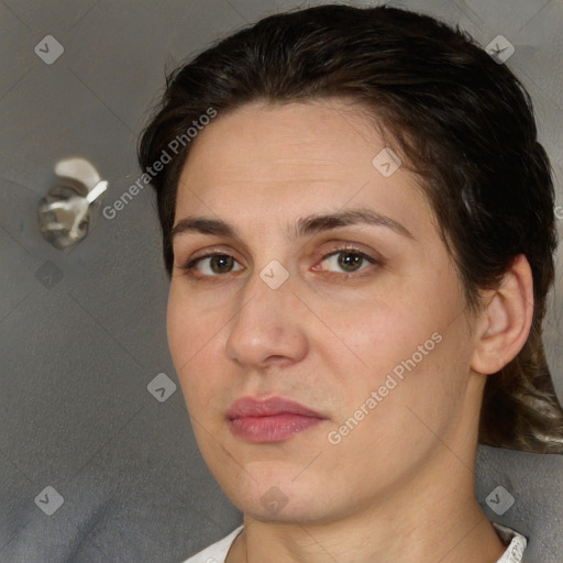 Joyful white adult female with short  brown hair and brown eyes