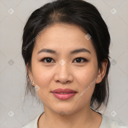 Joyful asian young-adult female with medium  brown hair and brown eyes