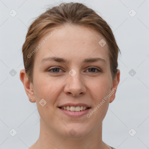 Joyful white young-adult female with short  brown hair and grey eyes