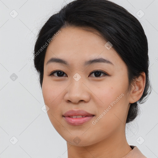 Joyful asian young-adult female with medium  black hair and brown eyes