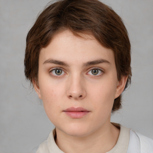 Neutral white young-adult female with medium  brown hair and green eyes