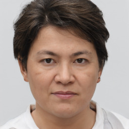 Joyful white adult female with short  brown hair and brown eyes