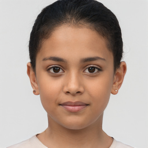 Joyful latino child female with short  brown hair and brown eyes