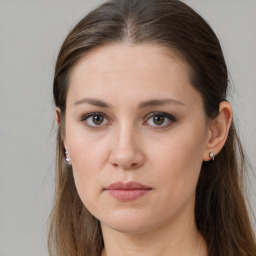 Neutral white young-adult female with long  brown hair and brown eyes