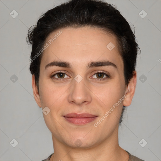 Joyful white young-adult female with short  brown hair and brown eyes