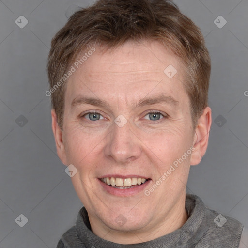 Joyful white adult male with short  brown hair and grey eyes