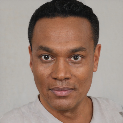 Neutral black young-adult male with short  black hair and brown eyes