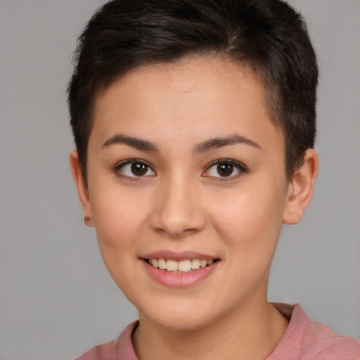 Joyful white young-adult female with short  brown hair and brown eyes