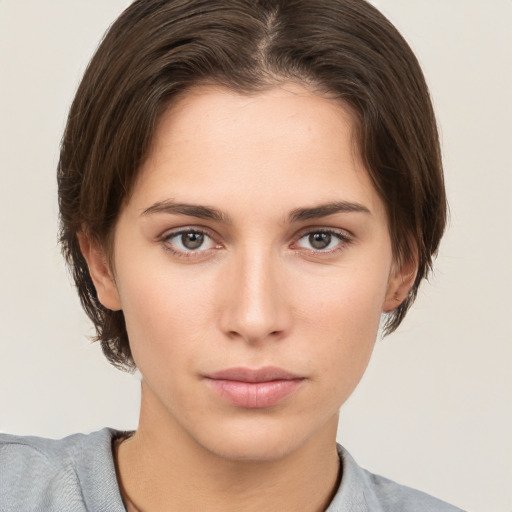 Neutral white young-adult female with short  brown hair and brown eyes