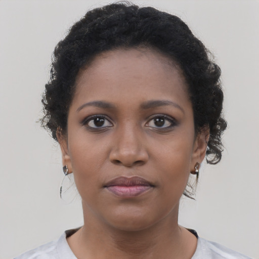 Neutral black young-adult female with short  black hair and brown eyes